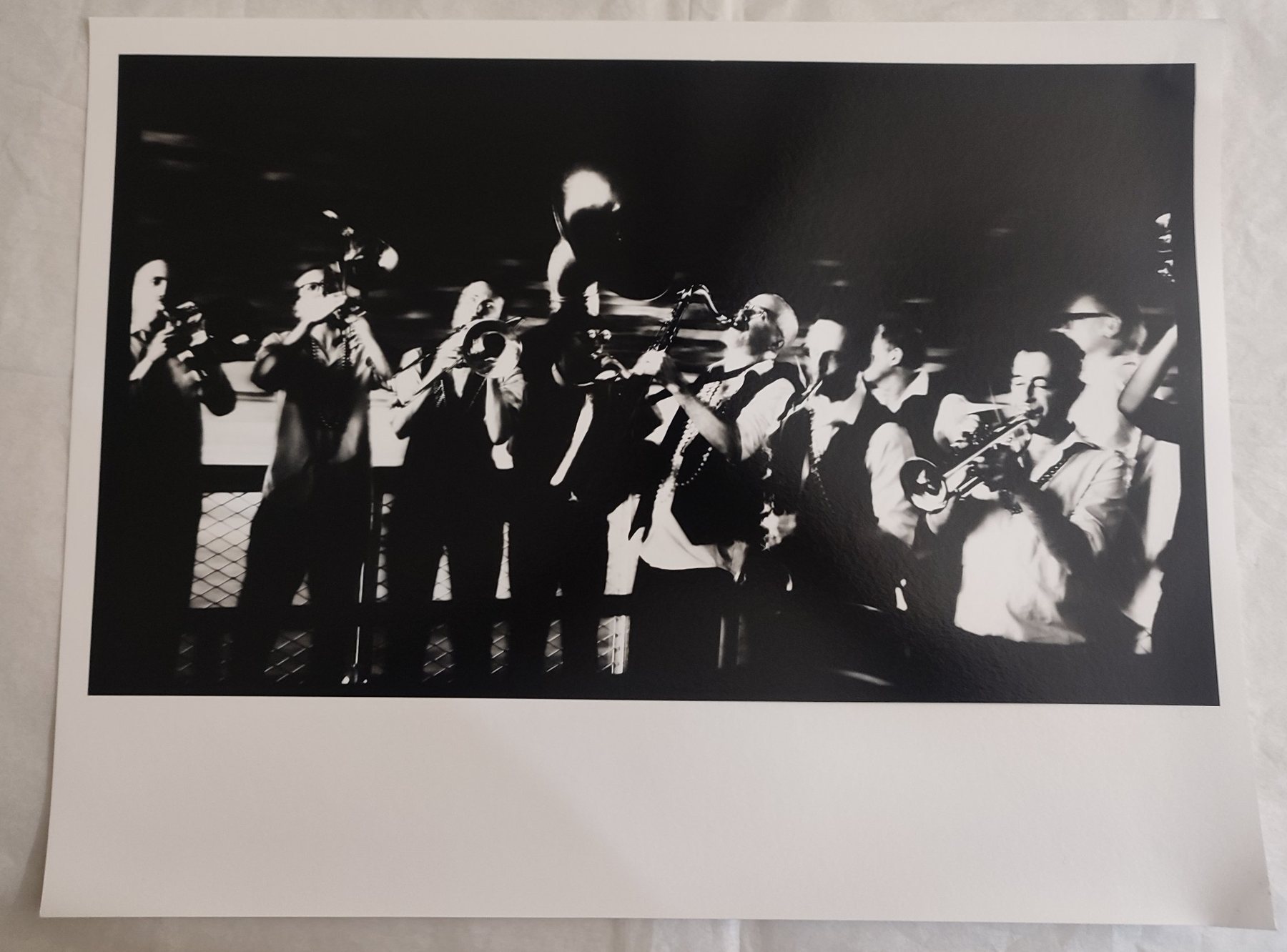 The finished print made from that negative: a brass band playing, in strong blacks and whites