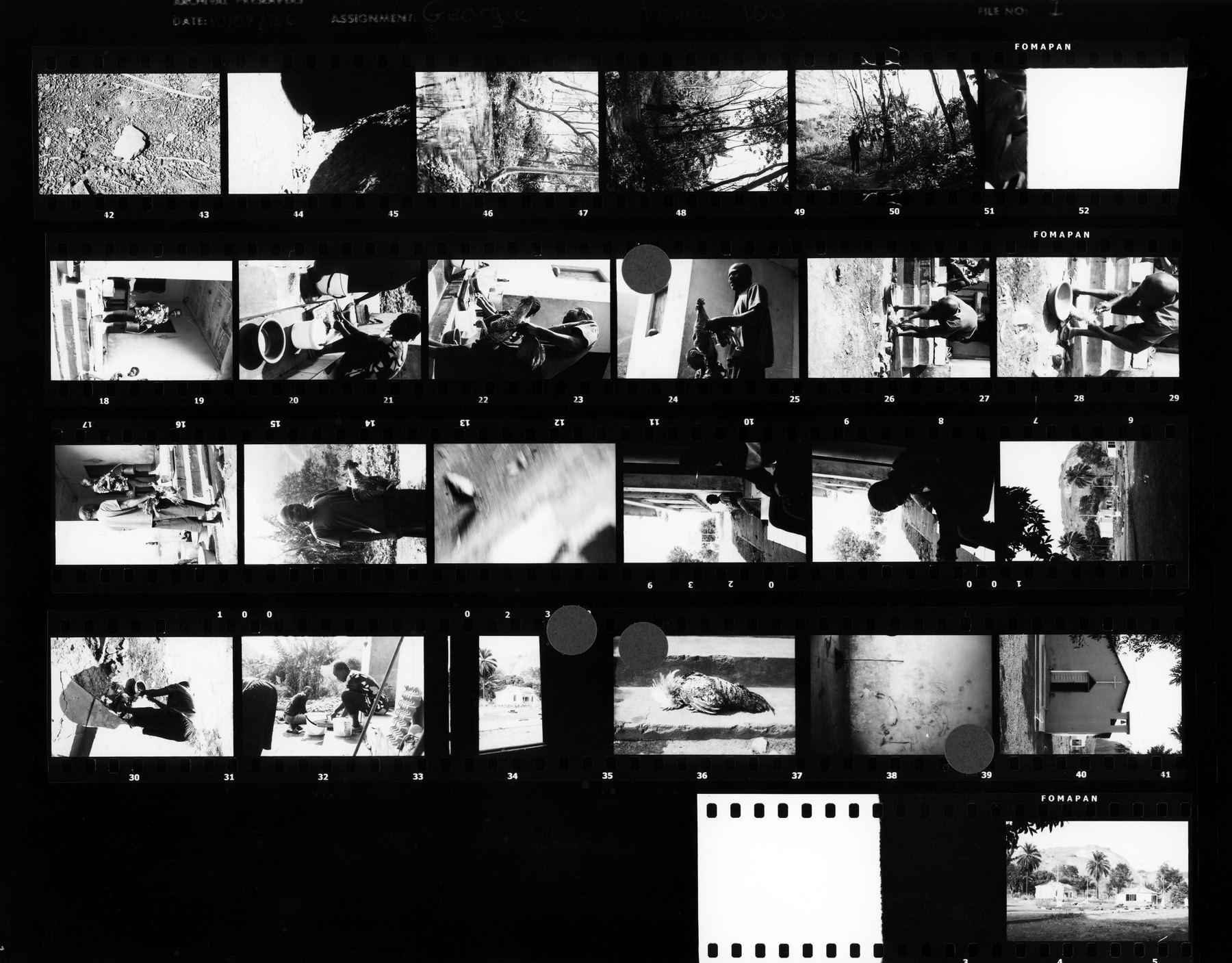 A contact sheet with frames marked in red grease pencil